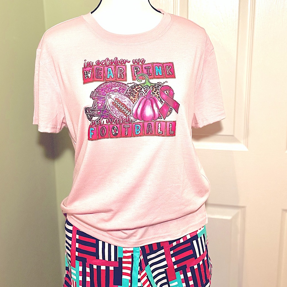 In Oct We Wear Pink And Watch Football Graphic Breast Cancer Pink T-Shirt🩷
